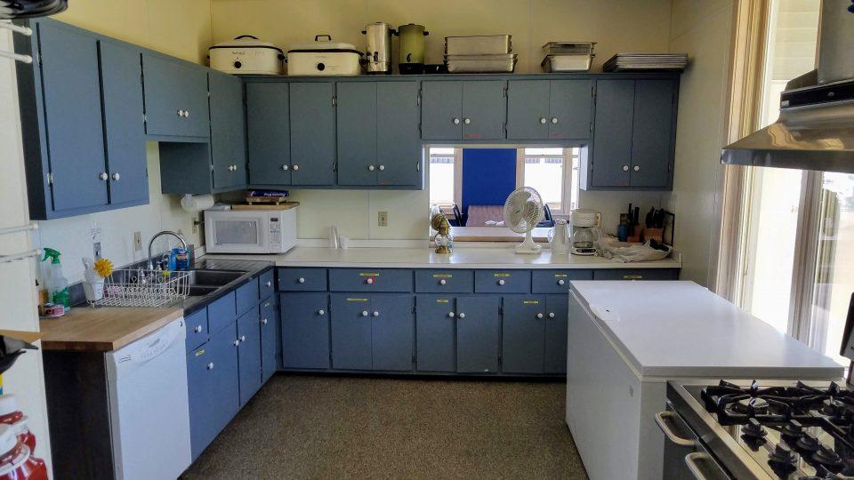 kitchen with faded blue cabinets